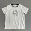 La textura es no más que diseño tridimensional cepillo de dientes bordado línea roja cuerda cachorro manga corta cuello redondo estilo casual camiseta 90% algodón damas