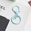 Accesorios para joyería DIY pintura de colores aleación de zinc redondo pequeño llavero de dragón cierre de langosta juego de 3 piezas hebilla colgante de juguete de 8 caracteres