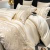 Ropa de cama europea de fábrica de alta gama de lujo ligero 60 algodón australiano suave para la piel cuatro piezas funda de edredón bordada en relieve sábana gorro de cama