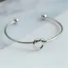 Pulsera de nudo de amor de acero de titanio transfronteriza, pulsera abierta con forma de corazón C, pulsera de brazalete con nudo, tendencia