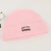 Gorro de punto estilo coreano con un pequeño patrón floral, hecho con tejido de mezcla de lana, diseñado para mujeres, adecuado para otoño e invierno, proporcionando calidez, grosor y protección para los oídos, y con un diseño moderno.