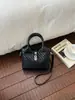 La popular bolsa pequeña explosiva de este año para mujer verano 2026 nuevo bolso de moda de un solo hombro cruzado bolso de cubo de mano transfronterizo