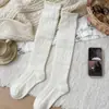 Calcetines de lana hasta la pantorrilla para mujer para otoño e invierno, tejido hueco con relieve de cachemira, adelgazantes, engrosados, cálidos, calcetines largos de tubo apilados