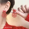 Pendientes festivos de texto de Año Nuevo Rojos Pendientes del año del dragón del Zodiaco Alto sentido sentido de diseño nicho Pendientes de otoño e invierno de Año Nuevo