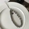 Cadena de Teléfono Tejida a Mano con Perlas Artificiales de Flor de Camelia Estilo Chanel de Moda, Colgante de Cristal Tejido de Lujo Ligero, Anti-Caída