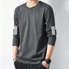 Camiseta informal de manga larga con cuello redondo, color liso, versátil, para hombre, otoño 2026, corte holgado, top moderno