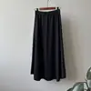 Falda midi de punto minimalista estilo coreano para mujer, nueva colección otoño/invierno 2026, de cintura alta, adelgazante, corte holgado, falda línea A suave y cómoda con dobladillo acampanado