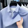 Camisa lisa de algodão para homens jovens e de meia-idade, estilo primavera e outono, confortável e amigável à pele, adequada para o trabalho diário e uso casual, camisa de manga comprida