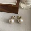 Crema color Aguja de Plata algodón de Xinjiang aretes de perlas grandes aretes para mujer diseño frontal y trasero aretes retro simples