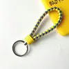 Llavero creativo de cuerda de cuero tejido a mano para pareja, llavero de coche, llavero al por mayor, colgante para bolso