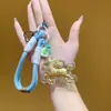 Nuevo Llavero Caballo de la Riqueza Shui Bei Colgante para Teléfono Adorno para Bolso Personalidad de Moda Diseño de Herradura Dorada