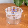 Los maceteros hidropónicos para tulipanes con cestas de plantación integradas facilitan el cambio del agua sin dañar las raíces; estos recipientes transparentes están diseñados específicamente para cultivar tulipanes en agua