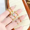Anillo Abierto de Zirconia con Goteo de Aceite Esmaltado Serie Dorada Vintage Retro Lujo Ligero de Gama Alta para Mujer