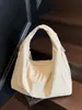 Bolsa de tela para axila de gran capacidad para mujer 2026 Nueva moda Casual Diseño de nicho Bolso de hombro Bolso tote simple y único