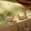 Estilo de corte europeo y americano oro ruso nicho nuevos aretes medievales borla perla diseño ojo de tigre aretes de alta gama