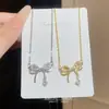 2026 Nova Exquisite Gargantilha Pingente Laço Zircônia para Mulheres, Luxo Leve, Nicho, High-end, Corrente Versátil para Clavícula Atacado