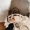 Bolsa feminina super popular para o trabalho, nova bolsa cesta vintage para o outono e inverno de 2026, bolsa de ombro e transversal para o dia a dia, bolsa feminina da moda