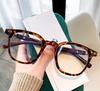 Nuevas gafas TR90 m con montura redonda y diseño de uñas, estilo retro, con patas de madera y antiluz azul, a juego para hombres y mujeres.
