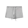 Top regata sexy sem mangas estilo americano, camisole curta de cintura alta justa ao corpo, shorts esportivos fitness de cintura baixa com cordão que abraçam o quadril