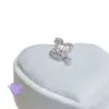 Clavos para Hélice de Oreja de Gota de Agua de Saturno Microincrustados Pendientes de Acero de Titanio Médico Estilo Coreano de Lujo Accesible de Nicho Pendientes para Piercing de Oreja para Mujeres