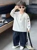 Camiseta de manga larga estampada para niños, primavera y otoño, estilo coreano, diseño de bloques de color, top casual para niños pequeños y niños, calidad de exportación