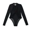 Body de malla con retazos cruzados de manga larga para mujer, fino y transparente para otoño, ajustado, sexy, capa base con entrepierna