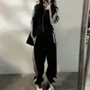 Conjunto deportivo casual de alta gama para mujer, sudadera con cremallera para primavera y otoño con bolsillos de rayas y pantalones de pierna ancha, venta al por mayor transfronteriza