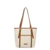 Bolsa de lona, bolsa de mano de gran capacidad, bolso de mano de moda casual nuevo europeo y americano, bolso de hombro simple y texturizado para el trabajo para mujer
