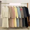Conjunto de Dos Piezas: Chaqueta Suéter de Color Sólido con Doble Cremallera + Falda de Punto 2025 Nuevo Traje de Suéter Otoño e Invierno para Mujer