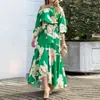 Vestido largo casual de vacaciones transfronterizo europeo y americano para mujer, estilo estampado, hombros descubiertos, cinturón de corbata, con bajo acampanado