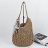 Bolso de paja nuevo de gran capacidad, bolso de hombro tejido casual estilo coreano calado, bolso versátil para mujer, bolso de playa para vacaciones junto al mar