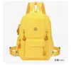 Mochila casual de moda de color sólido para mujer, con múltiples bolsillos, para ir al trabajo, bolsa escolar de tela Oxford