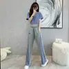 Nuevo traje sexy de mujer con vientre descubierto, cintura ajustada, corto, cintura alta, pierna ancha, costuras, estilo extranjero, traje de dos piezas