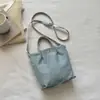 Bolso de Mano de Mezclilla Simple Casual Estilo Coreano para el Trabajo y los Viajes Diarios, Nuevo Bolso Cruzado Versátil Tipo Dumpling para Mujer 2026