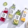 Venta al por mayor en stock Botella de Vidrio para Té de Leche Múltiples Especificaciones Cuadrada Redonda Engrosada Botella para Bebidas de Jugo con Tapa Venta Directa de Fábrica
