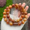 Agita las explosiones de sonido corazón material viejo pulsera de bodhi nube de fuego cuentas redondas doble círculo texto jugar cuentas de mano venta directa de fábrica