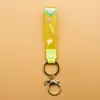 Llavero de accesorios de muñeca linda de cuerda de cuero de caucho suave pvc de arcoíris de deseo creativo accesorios de llavero para bolsa de pareja