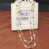 Colección Larga de Collares Superpuestos de Perlas Swarovski para Mujer, Estilo Lujo Ligero, Cadena Versátil para Suéter con un Toque de Alta Gama, Venta al por Mayor Otoño e Invierno