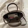 Bolsos de Moda Transfronterizos para Mujer 2026 Nuevo Nicho de Moda Bolso de Hombro Cruzado Versátil Bolso de Mano Elegante para el Trabajo Bolso Tipo Cubo