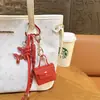 Serie Miu Transfronteriza Bolso Cuadrado Pequeño de Piel Regalo Creativo Billetera para Monedas Llavero Bolsa para Auriculares Colgante Llavero