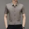 Camisa de verano 2023 nueva de solapa de manga corta moda letras taladro caliente camisa de hombre una generación de pelo