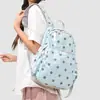 Mochila pequeña de moda transfronteriza 2026 nueva mochila impermeable de nailon para mujer, mini mochila ligera de lunares para viajar