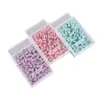Venta al por mayor de fábrica Clips para papel color macarrón Pequeños Frescos Creativos En caja Clip de cola de golondrina Papelería de oficina Etiqueta para llaves Banda de goma