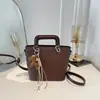 Bolso de cubo de moda con patrón tejido para mujer, nuevo estilo coreano 2026, bolso de mano versátil para salidas diarias y para ir al trabajo, bolso cruzado