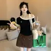 Camiseta de tirantes off-shoulder de manga corta para mujer, nuevo estilo verano 2026, pura y deseable, tacto de alta gama, bloques de color, top ajustado