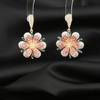 Pendientes de lujo ligeros con microincrustaciones de circonita en oro rosa con flores tridimensionales para mujer, temperamento de aguja de plata S925, joyería de alta gama al por mayor