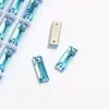 Fábrica de Rhinestones de Vidrio de Color K9 de Alta Calidad en Tira Larga AB, Rhinestones de Doble Agujero para Ropa DIY, Accesorios de Joyería de Forma Irregular