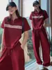Ropa Europea y Americana para Mujer Transfronteriza Conjunto Casual Rayado Manga Corta Media Cremallera + Pantalones de Pierna Ancha con Cordón Suministro Mayorista 1688