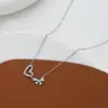 Cadena para clavícula elegante chapada en oro real con microincrustaciones de circonita, diseño de nicho femenino, collar con lazo de amor, collar versátil