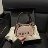 Bolsa Pequena Bordada Doce e Fofa para Mulheres 2025 Nova Bolsa de Mão Gatinho Retro Fosca Bolsa Transversal Texturizada Outono e Inverno